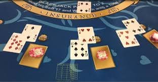 Studio lighting setup illuminating a Sic Bo table with three dice and clear betting interface